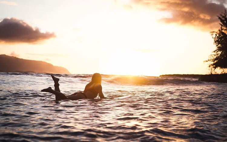 Sunset surfing at Puaena Point, Hawaii