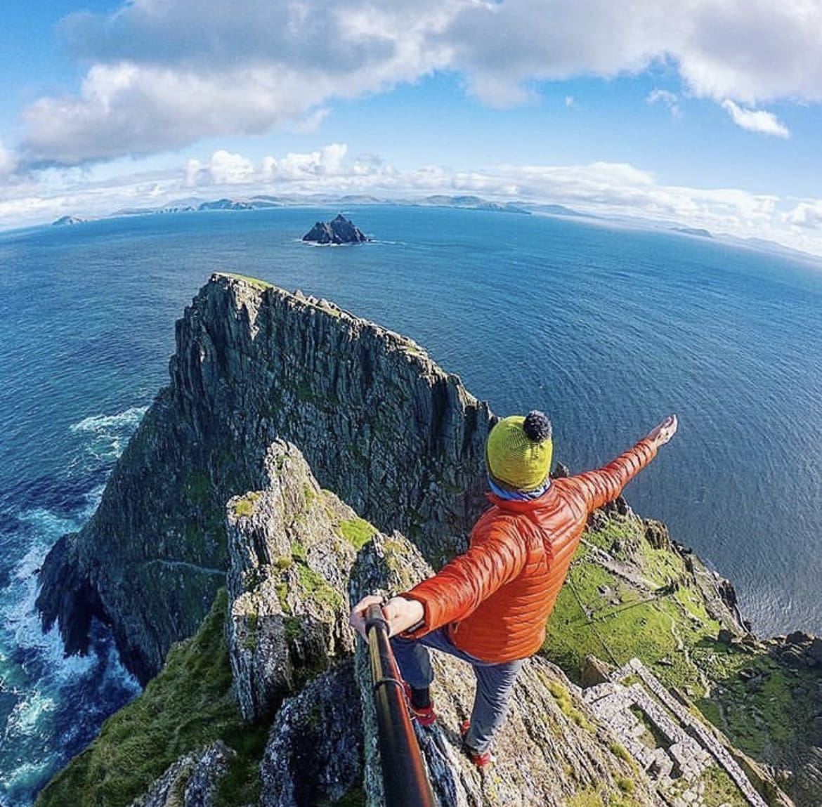 Walking on the edge of a cliff at Skellig Michael - The 22 Best Things to do in Ireland