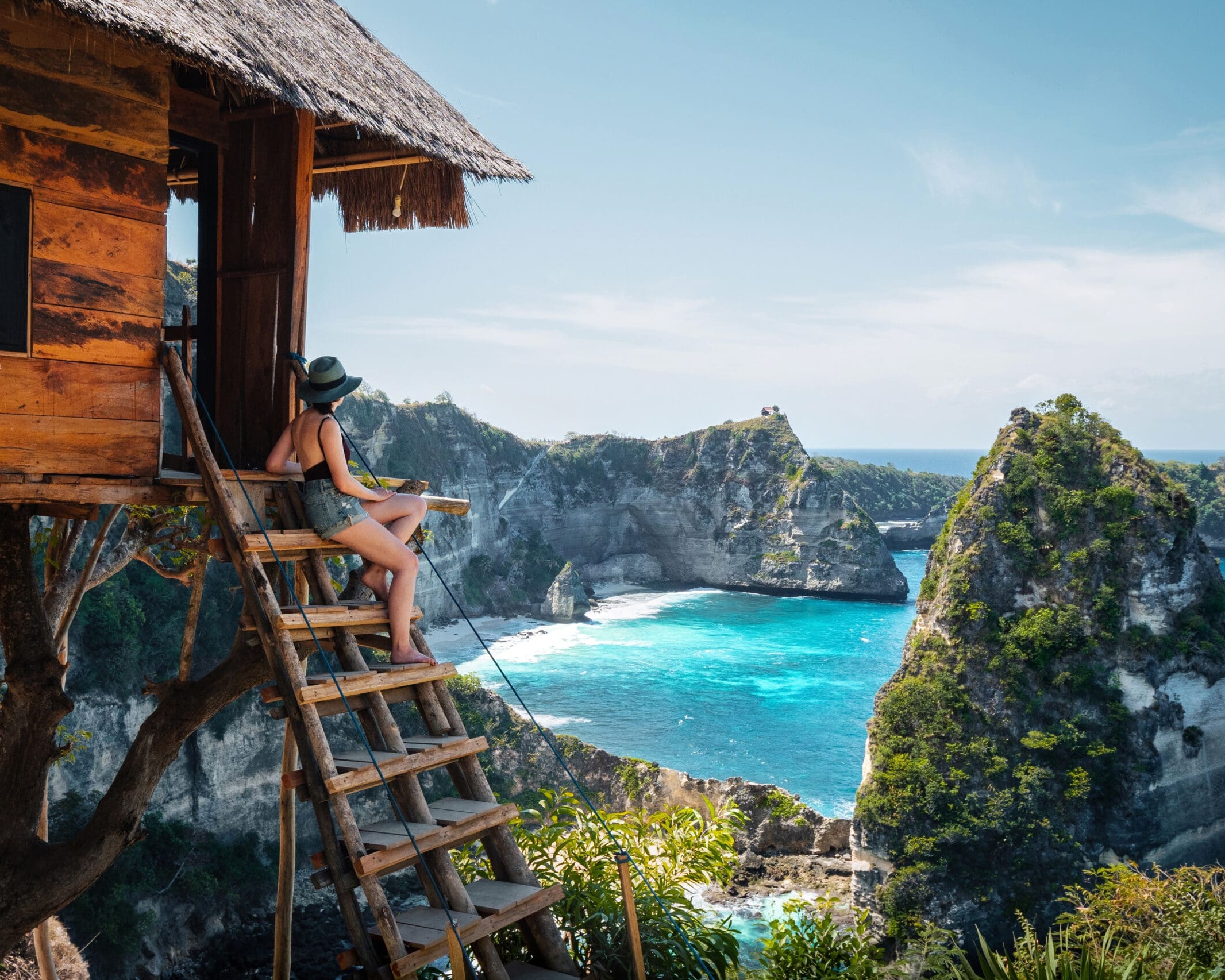 Bali, Indonesia, traveler on tree house at Diamond Beach in Nusa Penida Island.