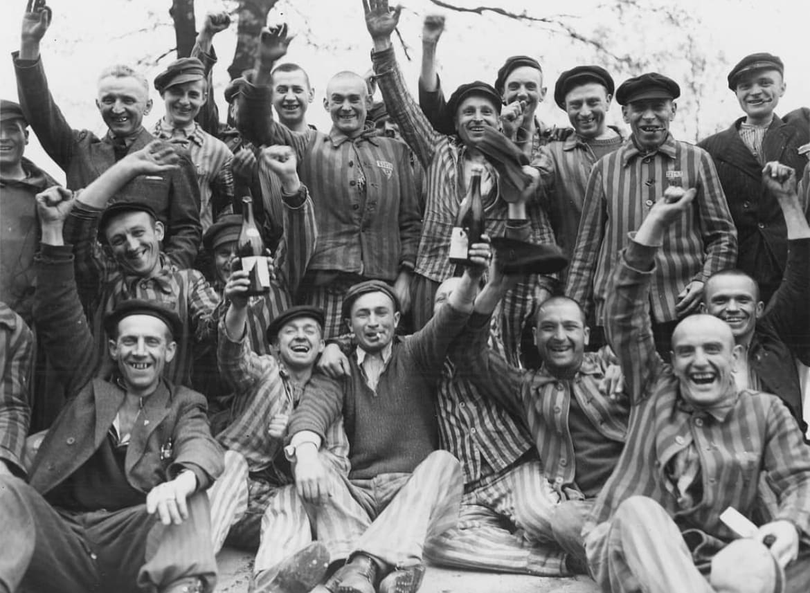 Polish prisoners celebrate their liberation from Dachau Concentration Camp in 1945